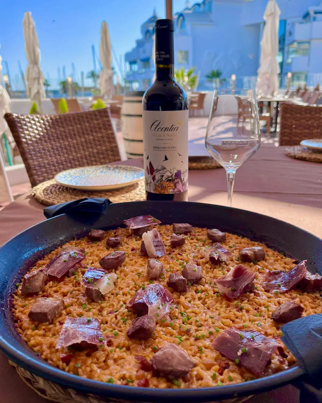 Paella with wine at Arrocería La Barraca