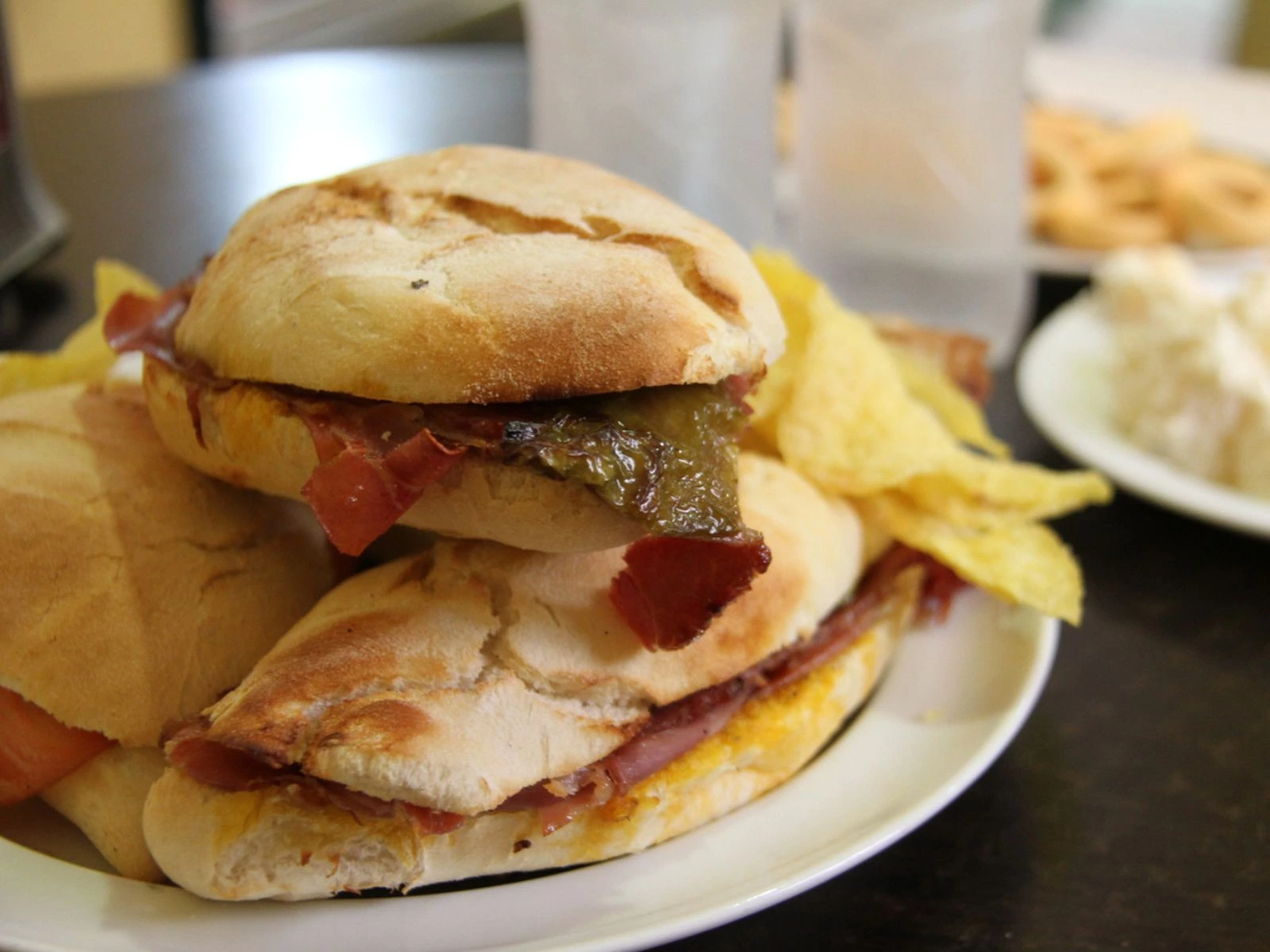 Classic montadito with pork loin, peppers and Serrano ham in Sevilla